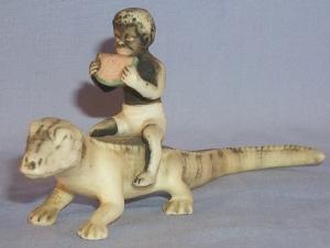 Black Boy Eating Watermelon Sitting On Alligator Porcelain Figurine - Ethnographic