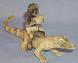 Black Boy Eating Watermelon Sitting On Alligator Porcelain Figurine - Ethnographic