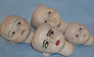 Four Bisque Porcelain Baby Doll Heads