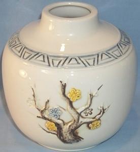 Raised Flower Decorated White Pottery Vase