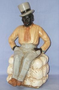 Ceramic BLACK MAN IN TOP HAT SITTING ON COTTON BALE Figurine - Ethnographic