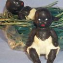 Ethnographic Two Bisque Black Babies in a Green Weaved Basket - Dolls