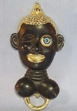 Ethnographic Black Worman's Head with Winking Eye Bottle Opener - Metalware