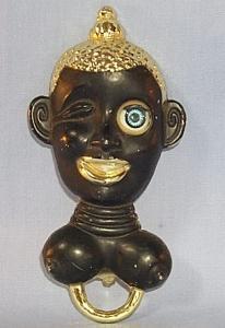 Ethnographic Black Worman's Head with Winking Eye Bottle Opener - Metalware