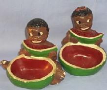 Two Ethnographic Chalkware Ashtrays With Black Boy And Girl Eating Watermelon