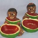 Two Ethnographic Chalkware Ashtrays With Black Boy And Girl Eating Watermelon