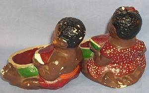 Two Ethnographic Chalkware Ashtrays With Black Boy And Girl Eating Watermelon