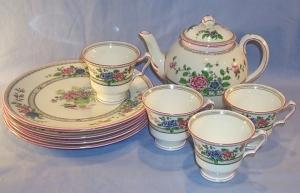 English Porcelain Flower Decorated TeaSet With Tea Pot And Four Luncheon Plates And Four Cups.
