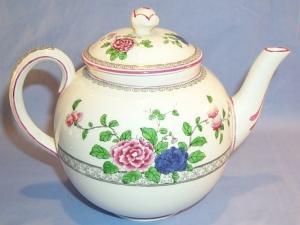 English Porcelain Flower Decorated TeaSet With Tea Pot And Four Luncheon Plates And Four Cups.