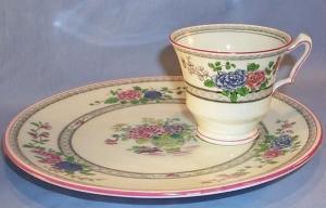 English Porcelain Flower Decorated TeaSet With Tea Pot And Four Luncheon Plates And Four Cups.