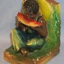 One Ethnographic Chalkware BookEnd BOY EATING WATERMELON