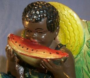 One Ethnographic Chalkware BookEnd BOY EATING WATERMELON