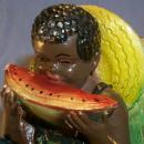 One Ethnographic Chalkware BookEnd BOY EATING WATERMELON