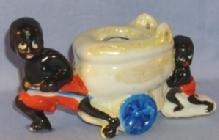 Black Memorabilia, Two Black Boys Pulling & Pushing A Toilet On Wheels Porcelain Figurine.