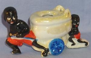Black Memorabilia, Two Black Boys Pulling & Pushing A Toilet On Wheels Porcelain Figurine.