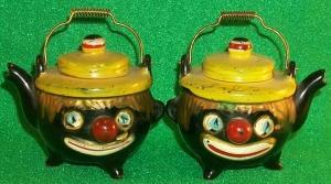 Salt & Pepper Shakers Shaped Like A Tea Pot With Clown Faces.