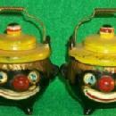 Salt & Pepper Shakers Shaped Like A Tea Pot With Clown Faces.