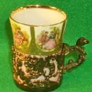 Small Porcelain Decorated Victorian Cup In Metal Holder