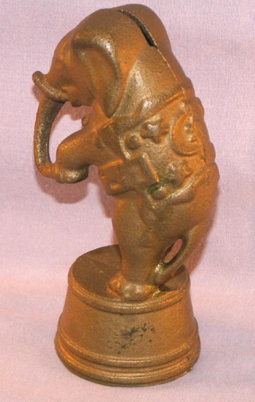 Cast Iron ELEPHANT ON STAND Bank - Toys