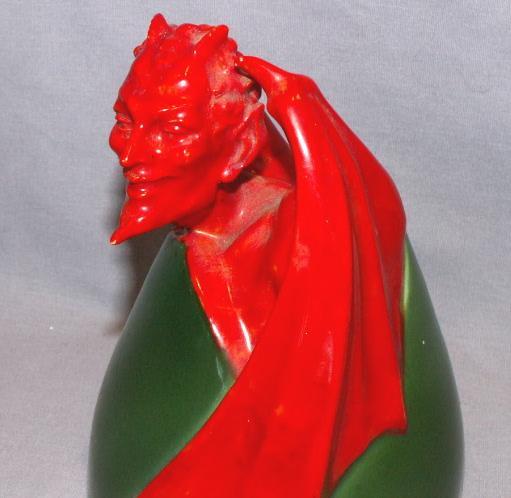 Porcelain Devil Figurine on Egg
