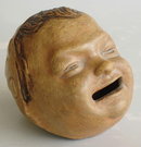 ANTIQUE GERMAN CRYING BABY FACE POTTERY COIN