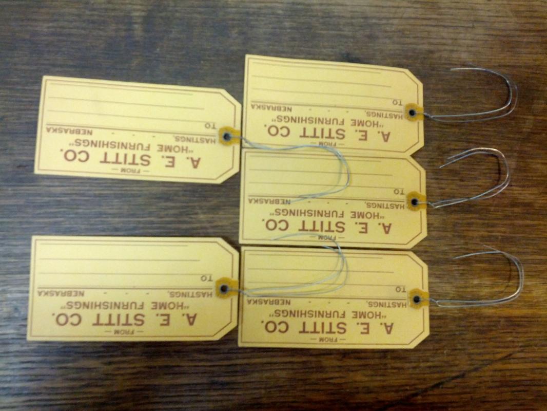 A E STITT COMPANY HOME FURNISHINGS CARDBOARD TAG HASTINGS NEBRASKA BUSINESS ADVERTISING TICKET DENISON IOWA USA MADE LABEL