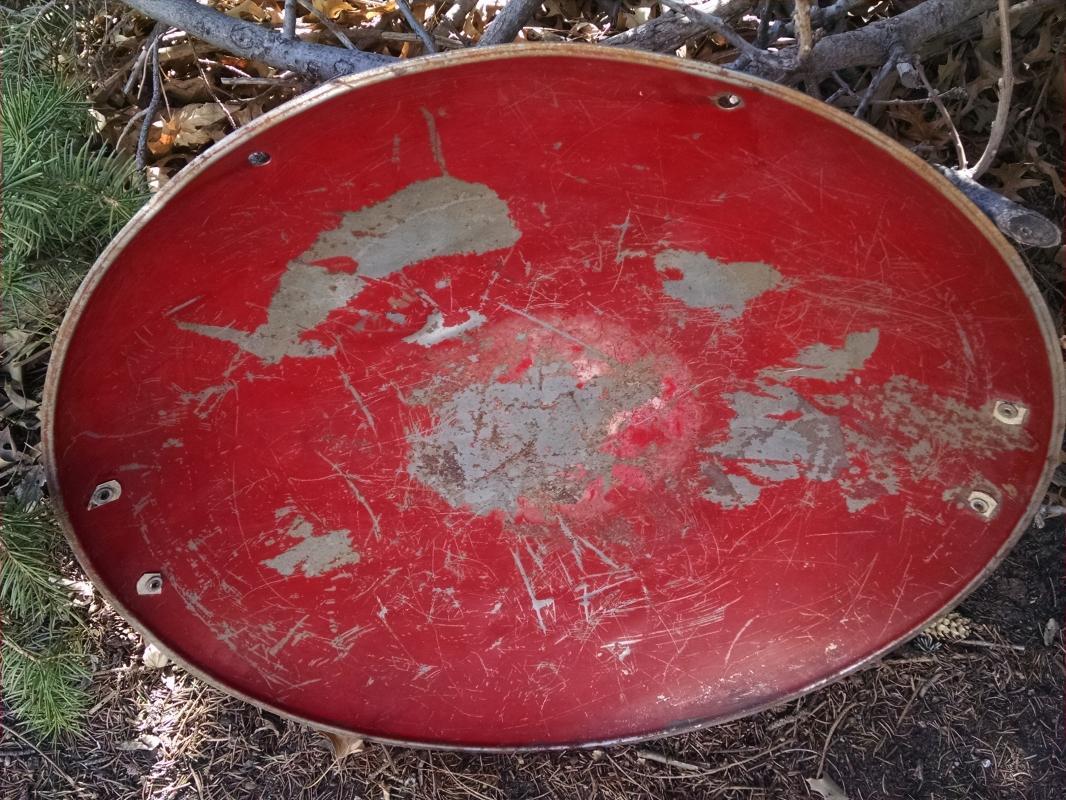 steel round disc style sled 1950's snow hill sliding equipment childrens winter toy old red painted wall decoration retro game room ornament