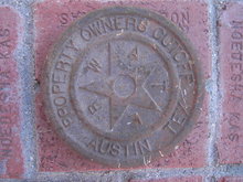 AUSTIN TEXAS CAST IRON WATER CAP PROPERTY MARKER DISC