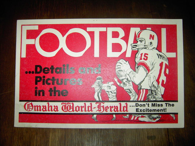 FOOTBALL SIGN OMAHA NEBRASKA WORLD HERALD NEWSPAPER BANNER RED WHITE CARDBOARD