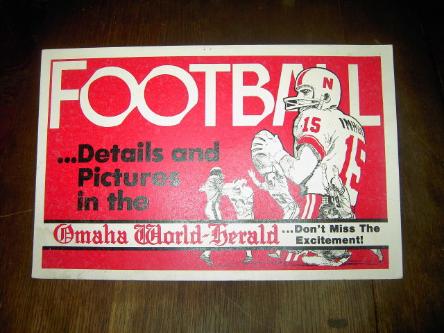 FOOTBALL SIGN OMAHA NEBRASKA WORLD HERALD NEWSPAPER BANNER RED WHITE CARDBOARD