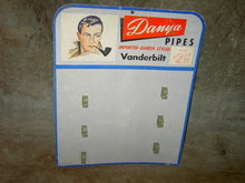 DANYA VANDERBILT IMPORTED DANISH STYLE PIPE BOARD STORE DISPLAY CARD CARDBOARD ADVERTISING SIGN