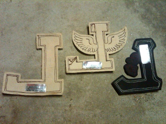 VARSITY LETTER L HIGH SCHOOL JACKET GARMENT APPAREL PATCH THEATRE BASKETBALL TRACK FIELD WINGS LOWE CAMPBELL ATHLETIC GOODS STICKER TAG