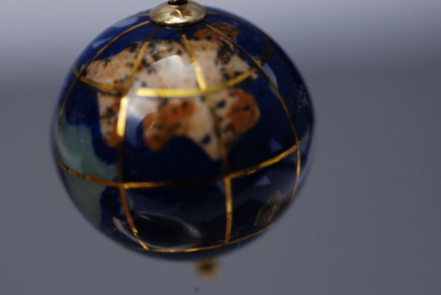 14k gold & lapis globe charm or pendant. inlaid with other semi-precious gemstones