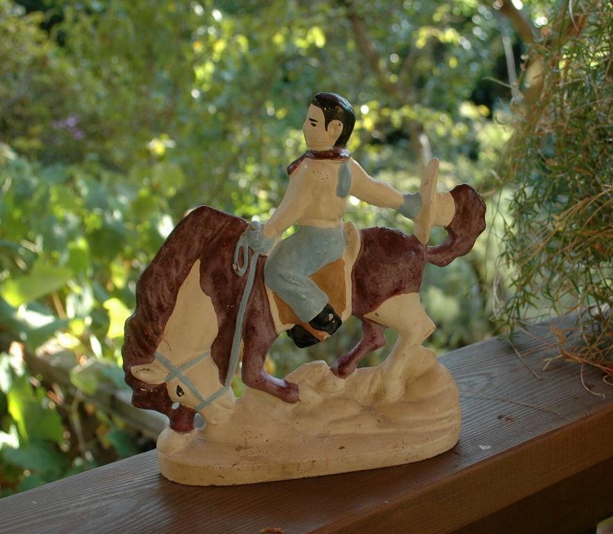 VINTAGE CAST IRON RODEO COWBOY DOORSTOP OR BOOKEND