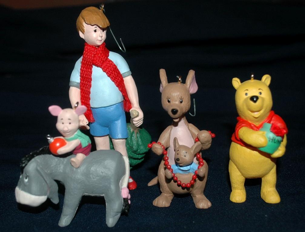 set of 4 1991 Winnie the Pooh Collection Series Hallmark Holiday Ornaments by Artist: Bob Siedler..