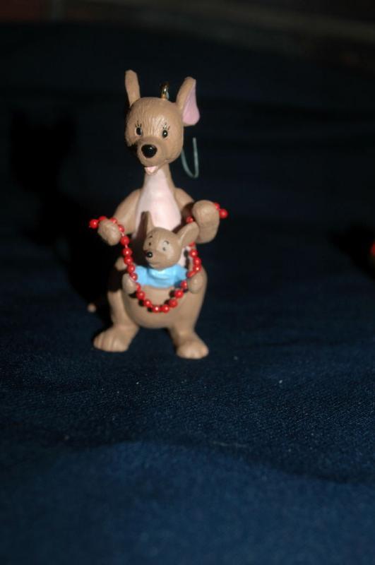 set of 4 1991 Winnie the Pooh Collection Series Hallmark Holiday Ornaments by Artist: Bob Siedler..
