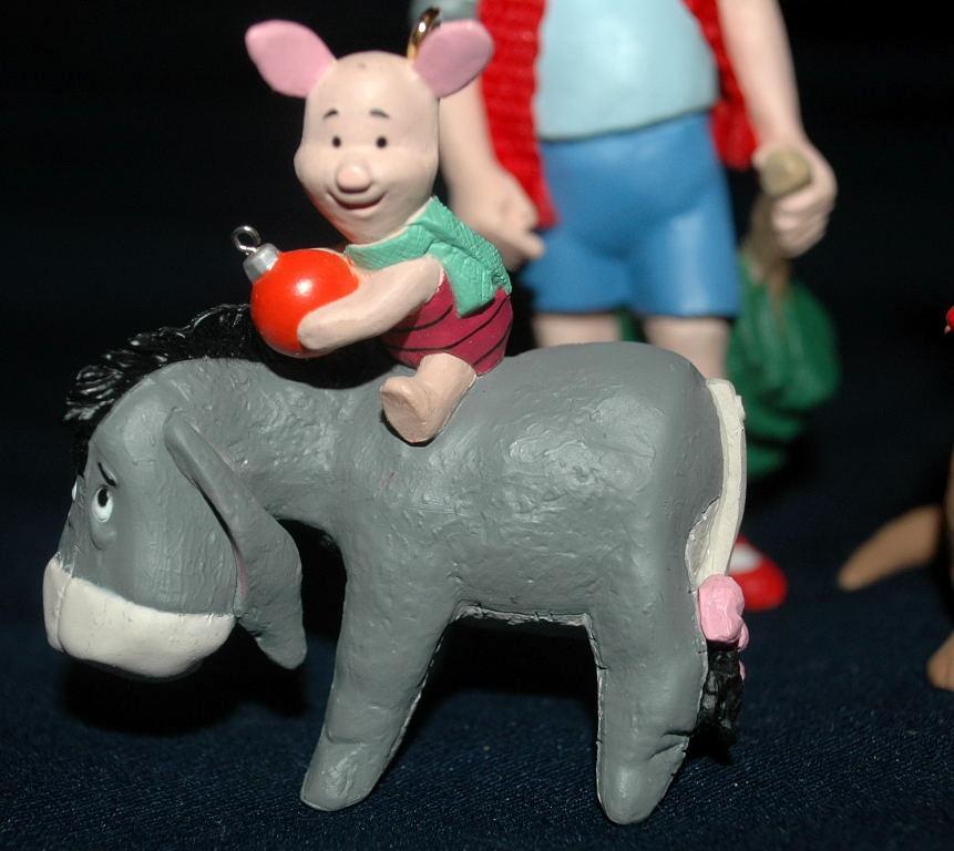set of 4 1991 Winnie the Pooh Collection Series Hallmark Holiday Ornaments by Artist: Bob Siedler..