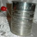 Bromwell’s tin flour sifter with a red painted wooden sifter handle