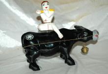 Asian Folk Art Wooden Bull with Articulated Head and Flute Player Rider.