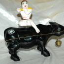 Asian Folk Art Wooden Bull with Articulated Head and Flute Player Rider.