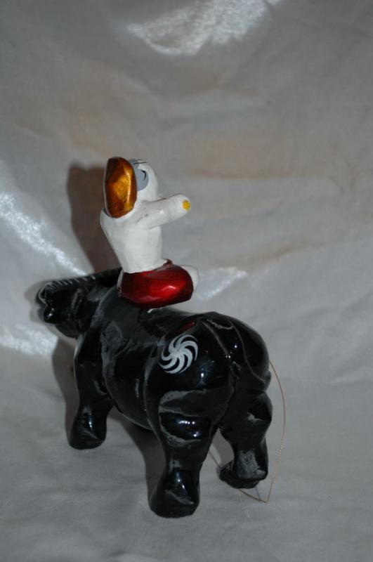Asian Folk Art Wooden Bull with Articulated Head and Flute Player Rider.