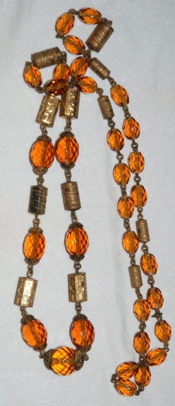Faceted Amber Glass and Engraved Brass Necklace. Very Old