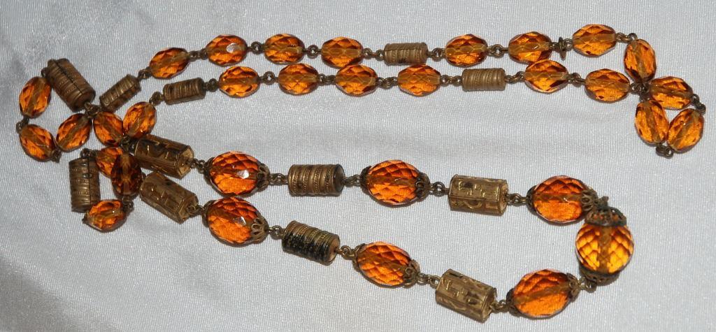 Faceted Amber Glass and Engraved Brass Necklace. Very Old
