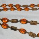 Faceted Amber Glass and Engraved Brass Necklace. Very Old
