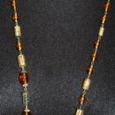 Faceted Amber Glass and Engraved Brass Necklace. Very Old