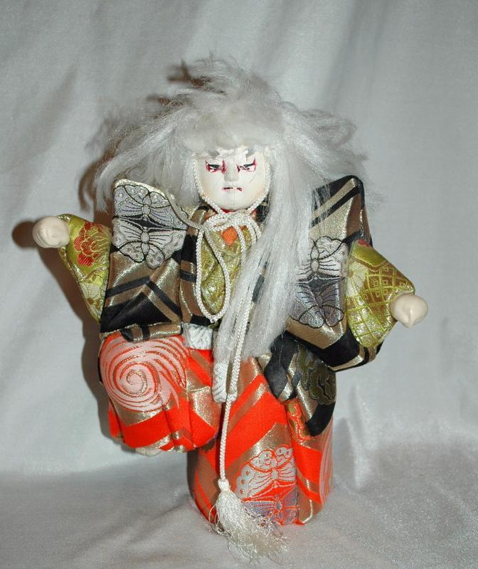 Doll of Kabuki Theatre actor as White Lion with one knee raised
