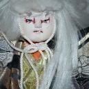 Doll of Kabuki Theatre actor as White Lion with one knee raised