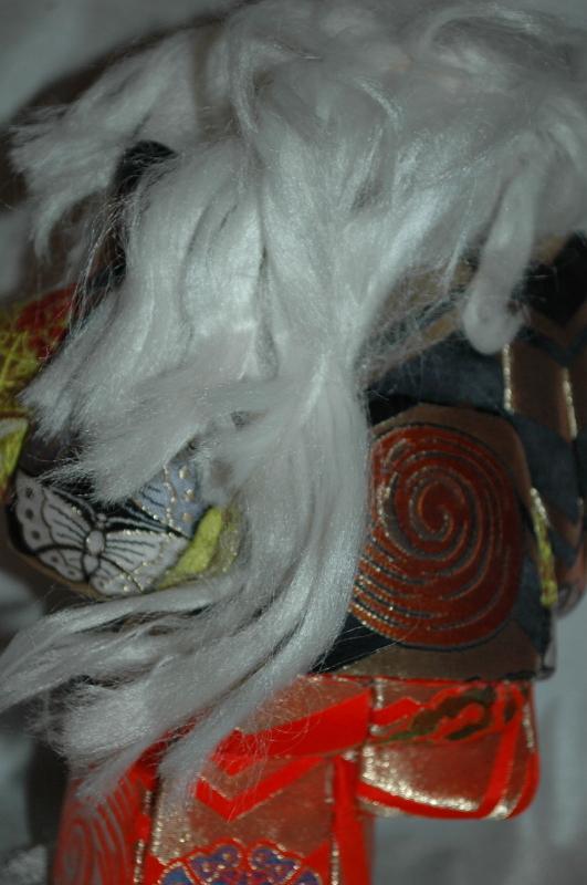 Doll of Kabuki Theatre actor as White Lion with one knee raised