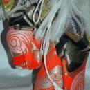 Doll of Kabuki Theatre actor as White Lion with one knee raised