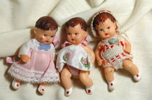 3 miniature jointed rubber baby dolls